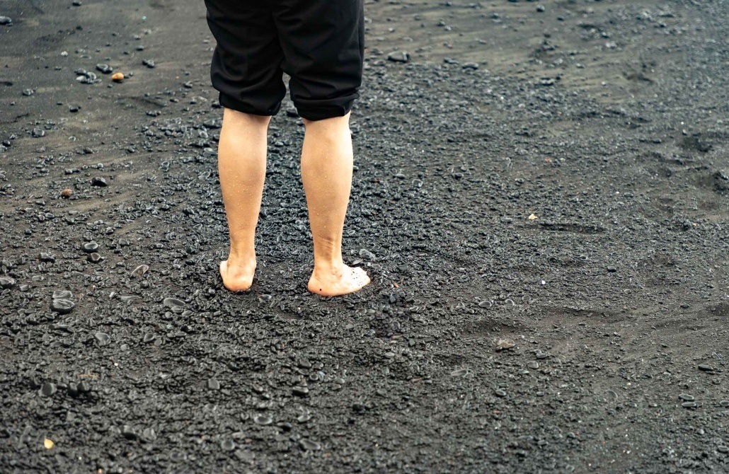 Black Sand Beach Feet in Sand Waianapanapa Road to Hana Maui