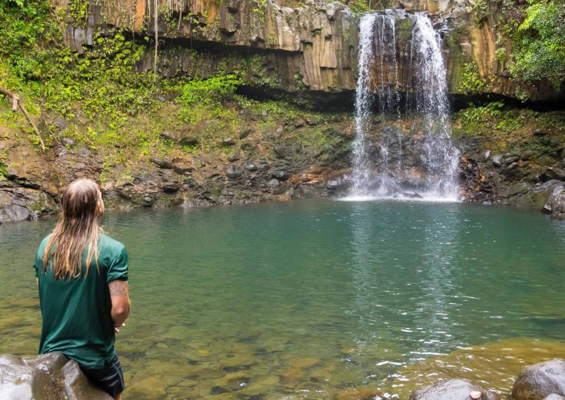 hikemaui hana waterfalls hiking tour taking pic of waterfall 