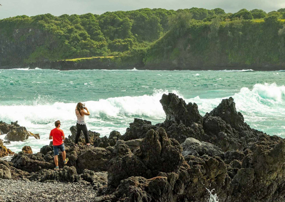 keanae peninsula visitor couple and waves road to hana maui  