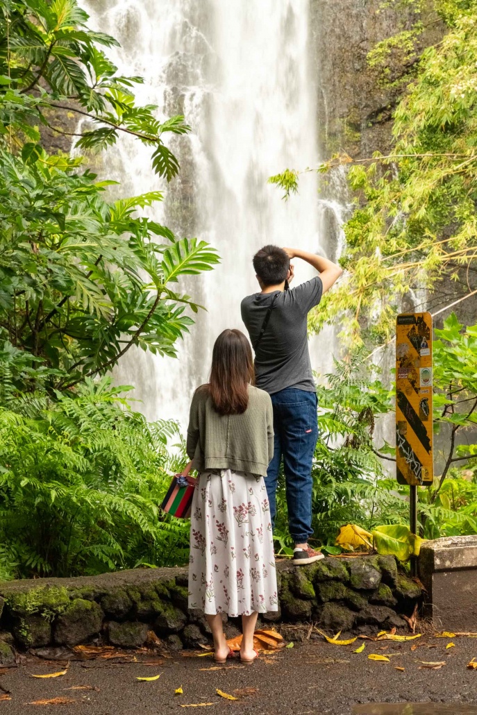 Honeymoon couple enjoy photography at Maui waterfall Hana
