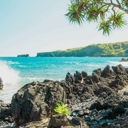 crashing waves over lava rock coast in keanae maui hawaii beach