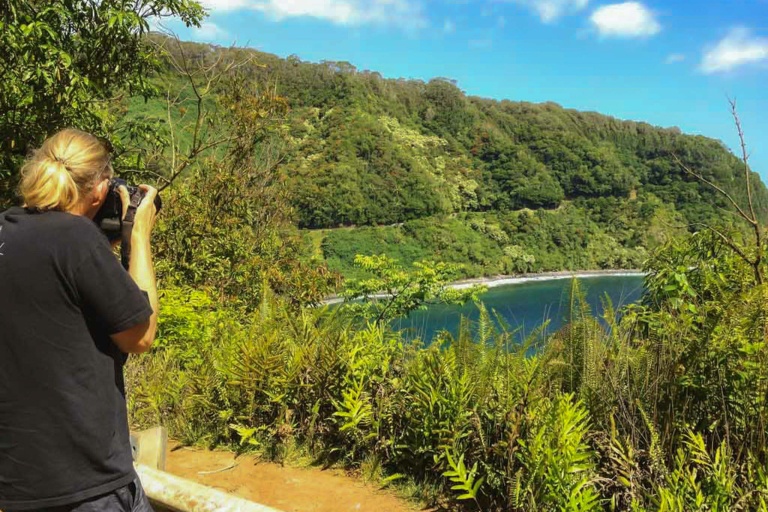 road to hana visitor photographing cliffs maui
